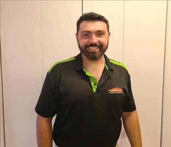 tech male, posing in black shirt and beard