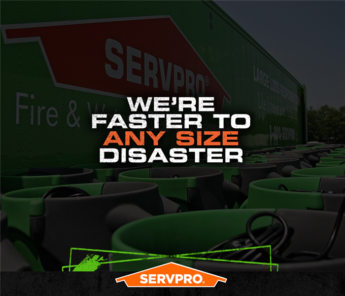 SERVPRO truck in front of water suction tools with cation: "WE'RE FASTER TO ANY SIZE DISASTER" 