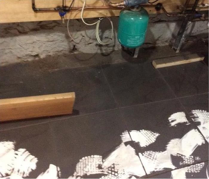 soot covering a white tile floor